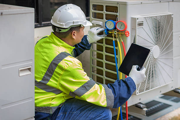 Professional Heat Pump Repair technician working in Van Buren, AR